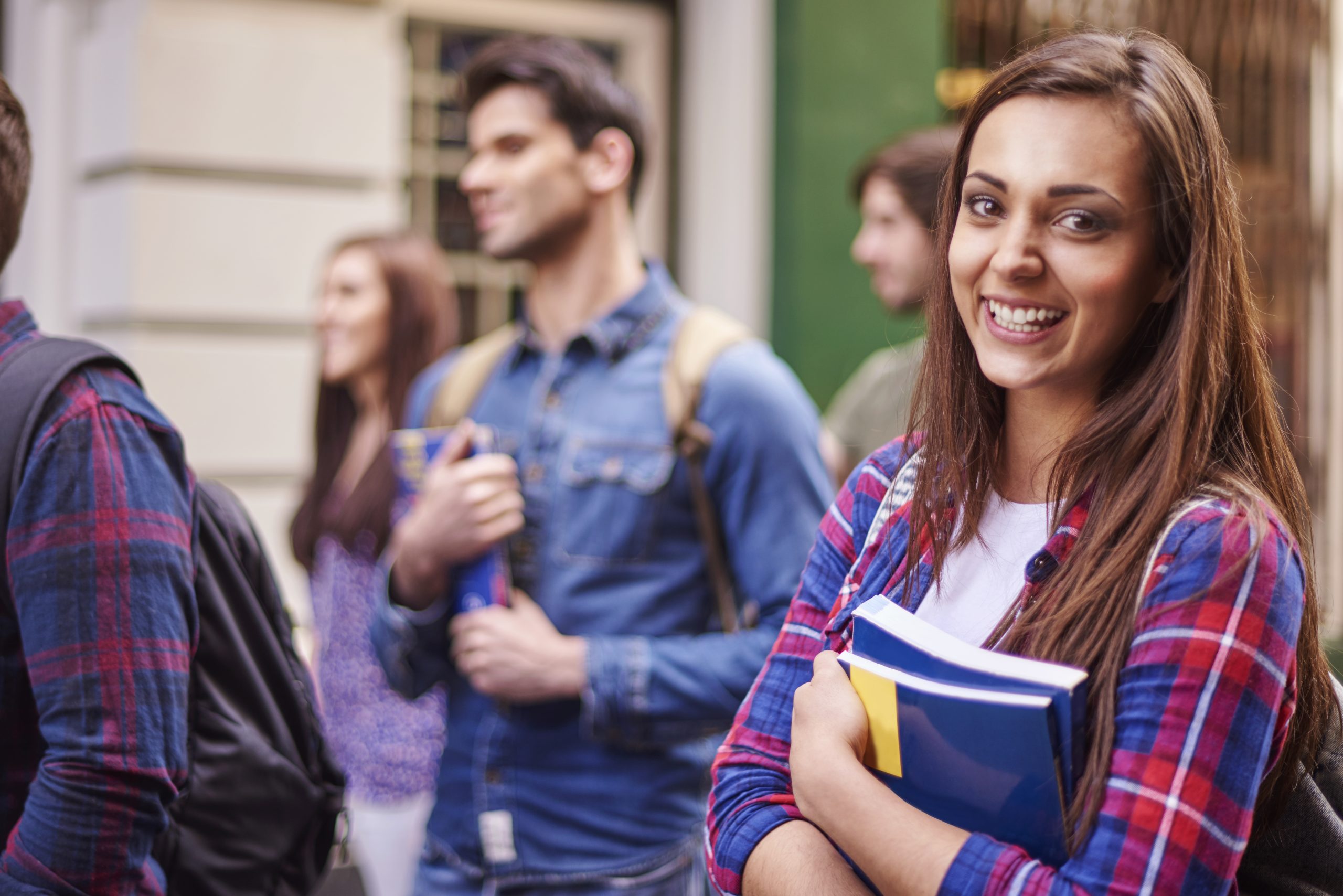 Female student holding her books